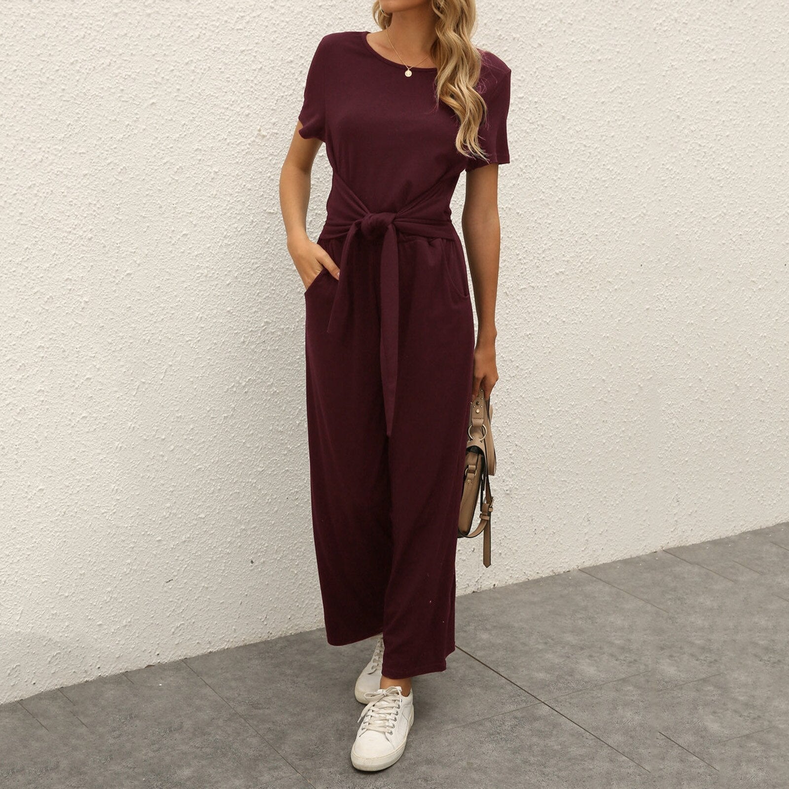 Figursyet outfit til fest og aften – Jumpsuit med strømpebåndsdetalje til kvinder
