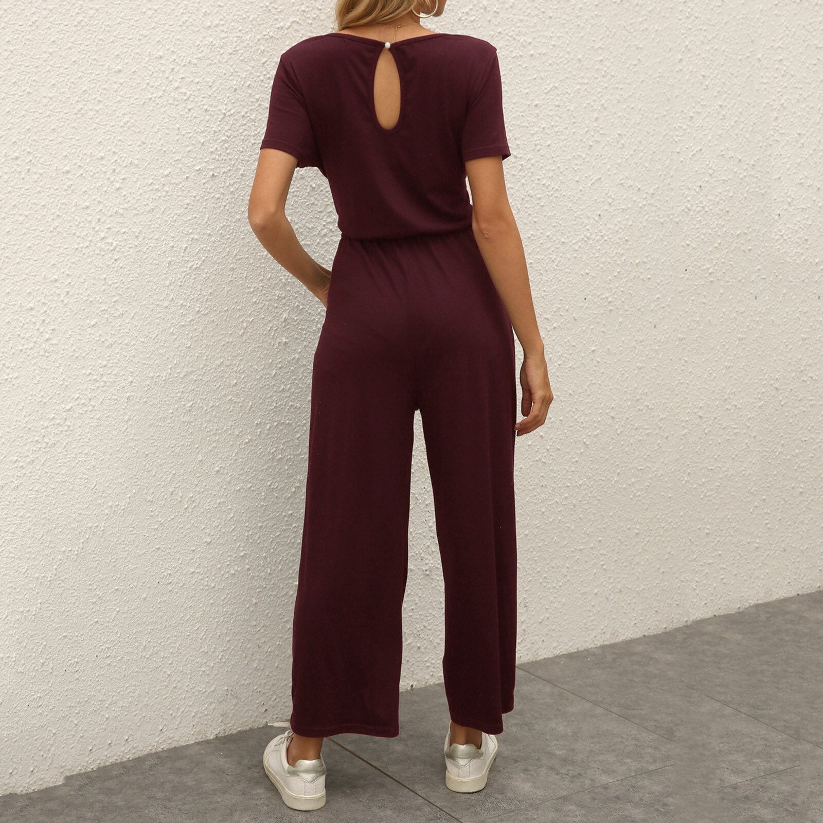 Figursyet outfit til fest og aften – Jumpsuit med strømpebåndsdetalje til kvinder