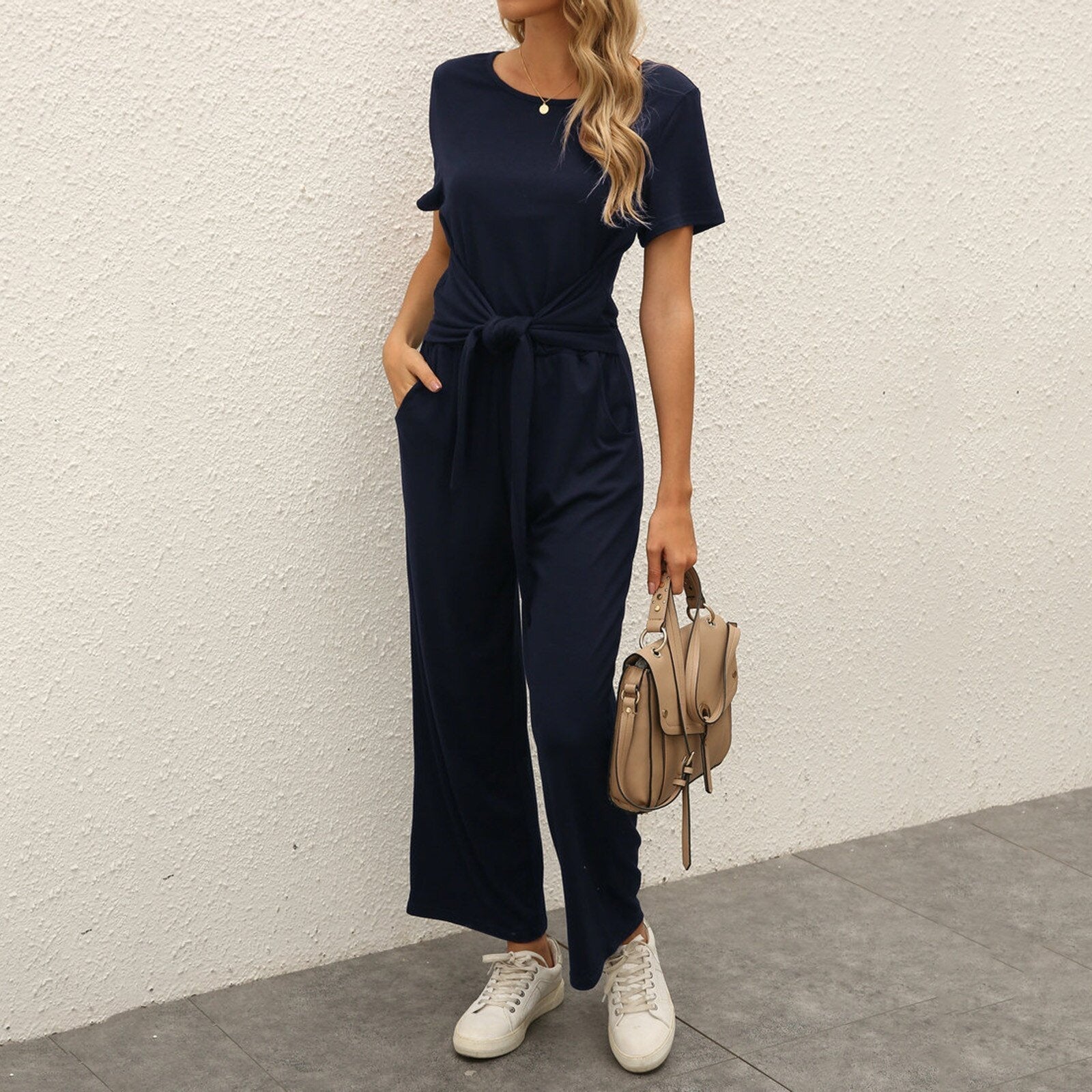 Figursyet outfit til fest og aften – Jumpsuit med strømpebåndsdetalje til kvinder