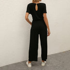 Figursyet outfit til fest og aften – Jumpsuit med strømpebåndsdetalje til kvinder