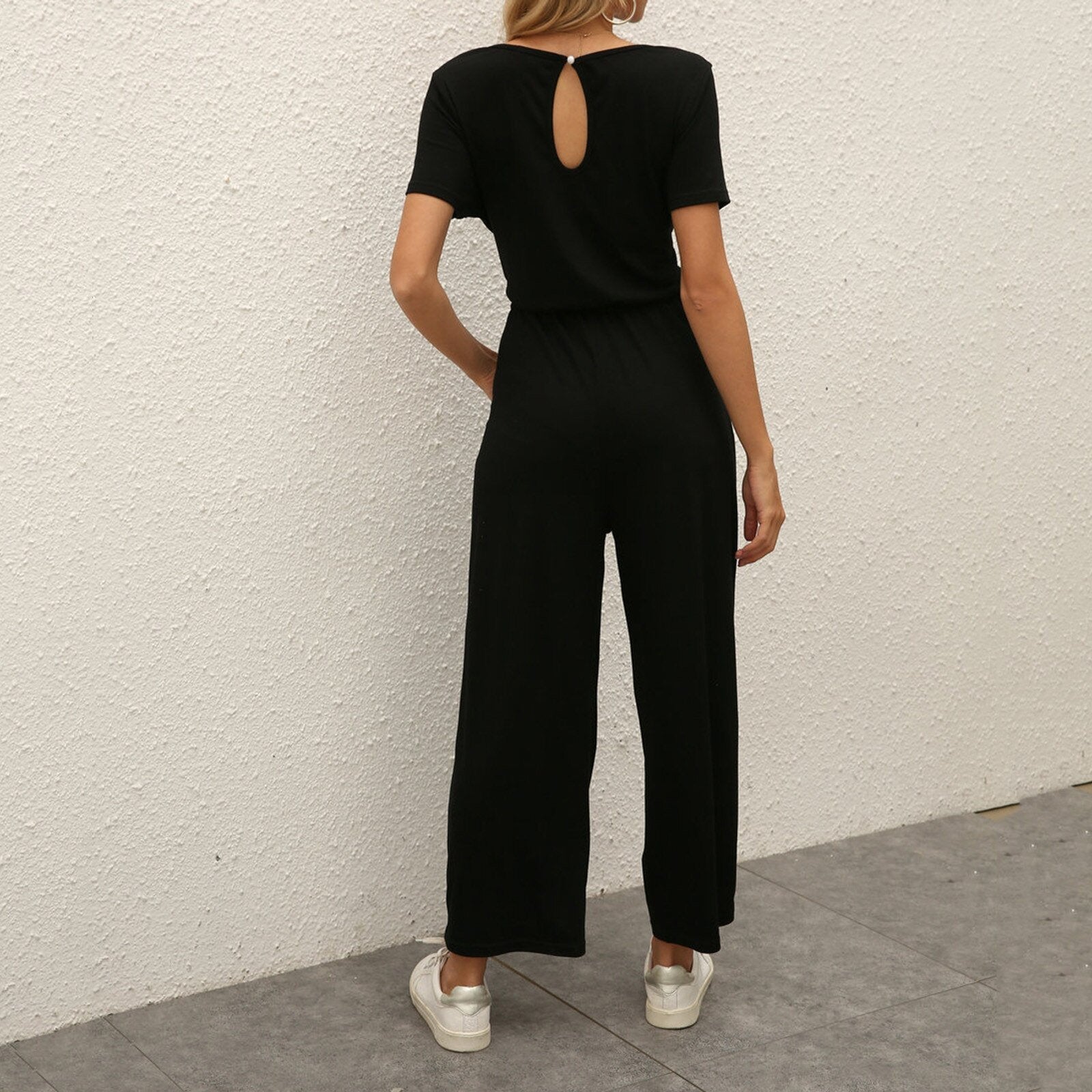 Figursyet outfit til fest og aften – Jumpsuit med strømpebåndsdetalje til kvinder