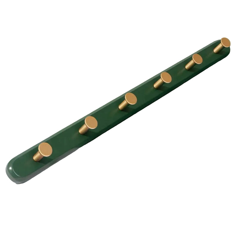 Vægknagerække med guldfarvede kroge til indendørs brug