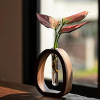 Plant vase with glass tube and wooden frame for indoor use