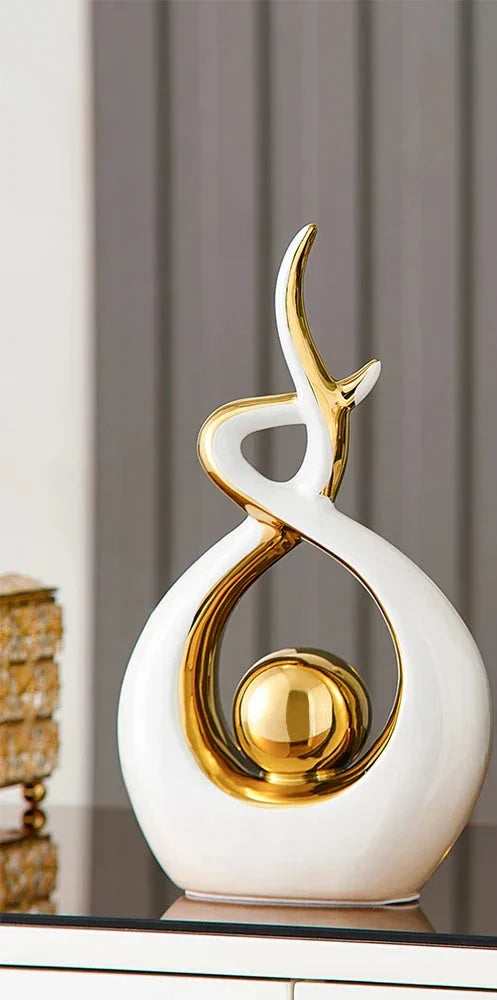 Abstract decorative figure in ceramic with gold finish