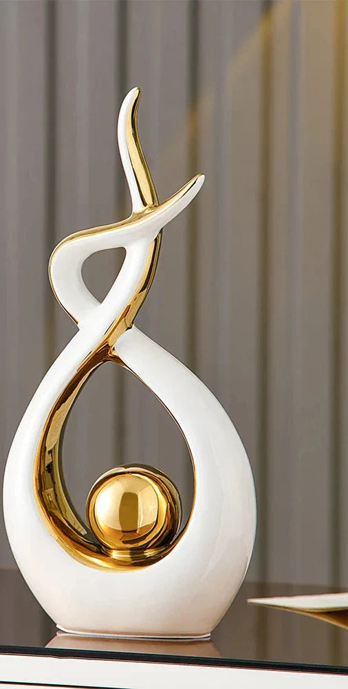 Abstract decorative figure in ceramic with gold finish
