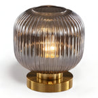 Table lamp with ribbed glass for indoor use