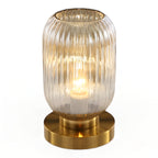 Table lamp with ribbed glass for indoor use