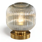 Table lamp with ribbed glass for indoor use