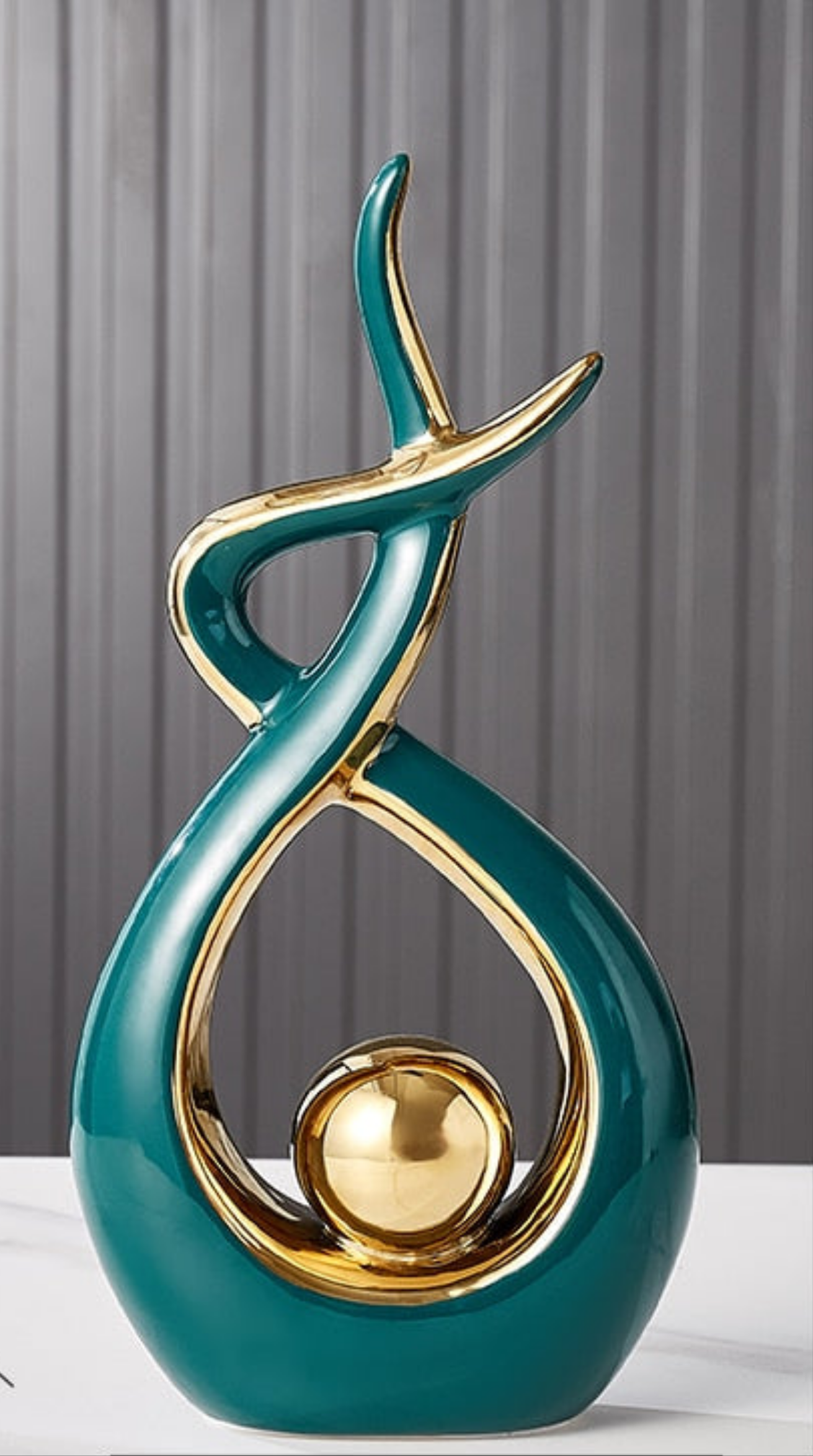 Abstract decorative figure in ceramic with gold finish