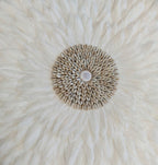 Decorative wall decoration with white feathers