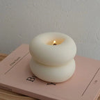 Aromatherapy candle in donut shape for indoor use