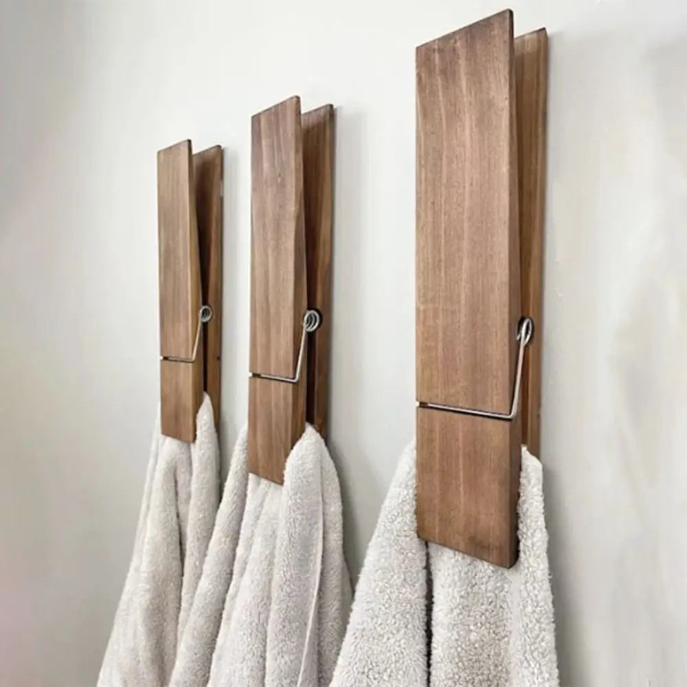 Towel holder shaped like a clothespin in wood