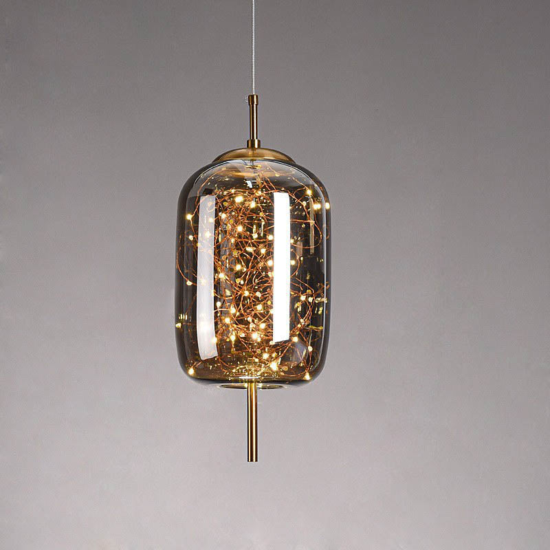 Warm ceiling lighting for living room and dining area – LED pendant lamp in glass in amber or anthracite gray