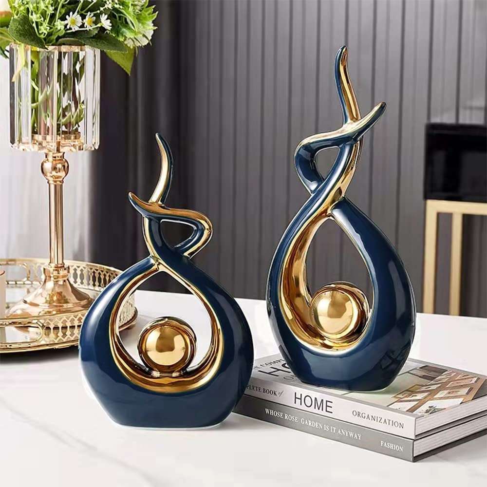 Abstract decorative figure in ceramic with gold finish