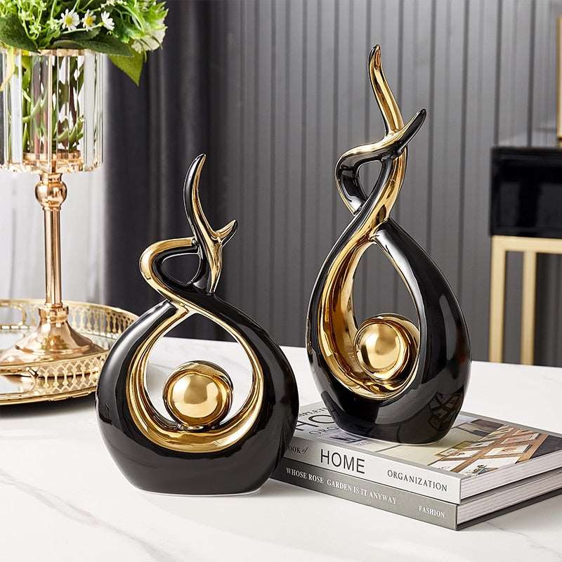 Abstract decorative figure in ceramic with gold finish