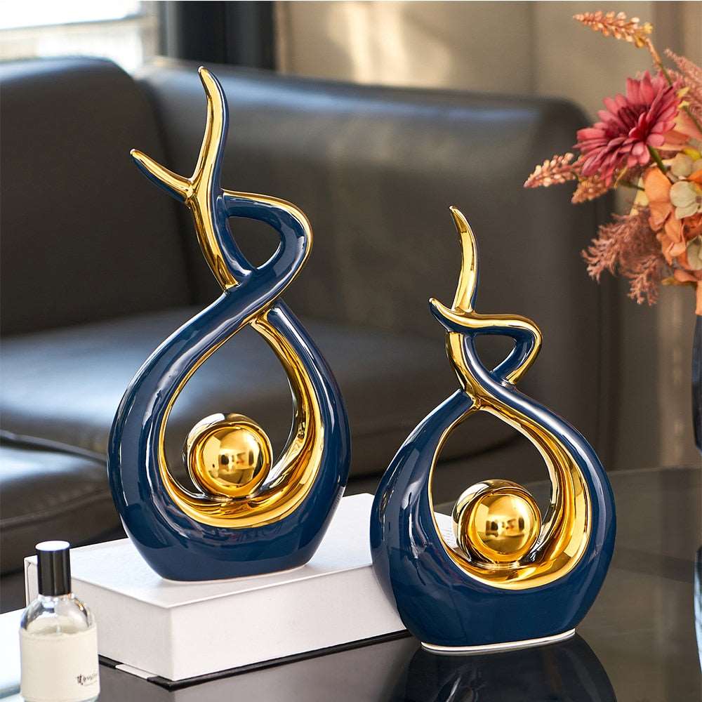 Abstract decorative figure in ceramic with gold finish
