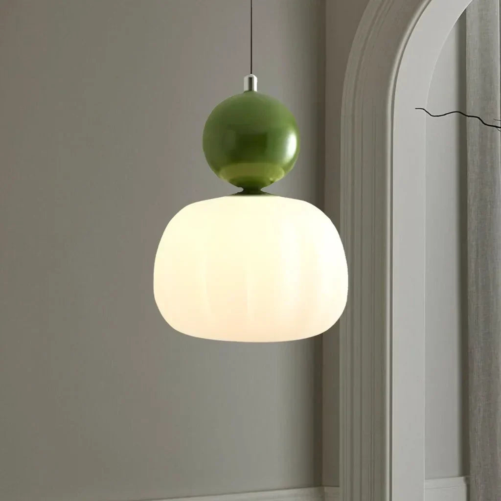 Pendant lamp with glass globe and decorative top for indoor use