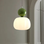 Pendant lamp with glass globe and decorative top for indoor use
