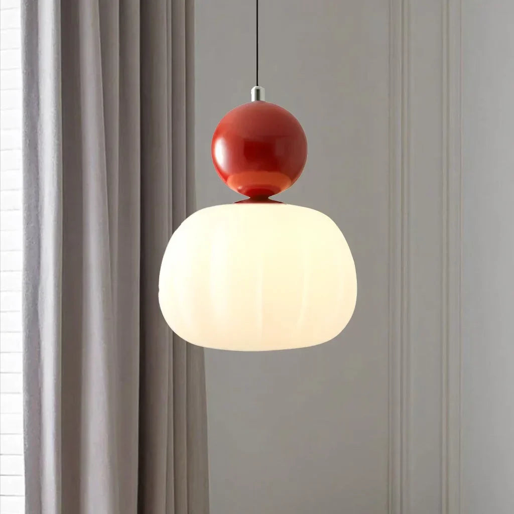 Pendant lamp with glass globe and decorative top for indoor use