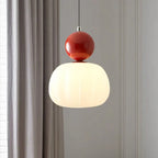 Pendant lamp with glass globe and decorative top for indoor use