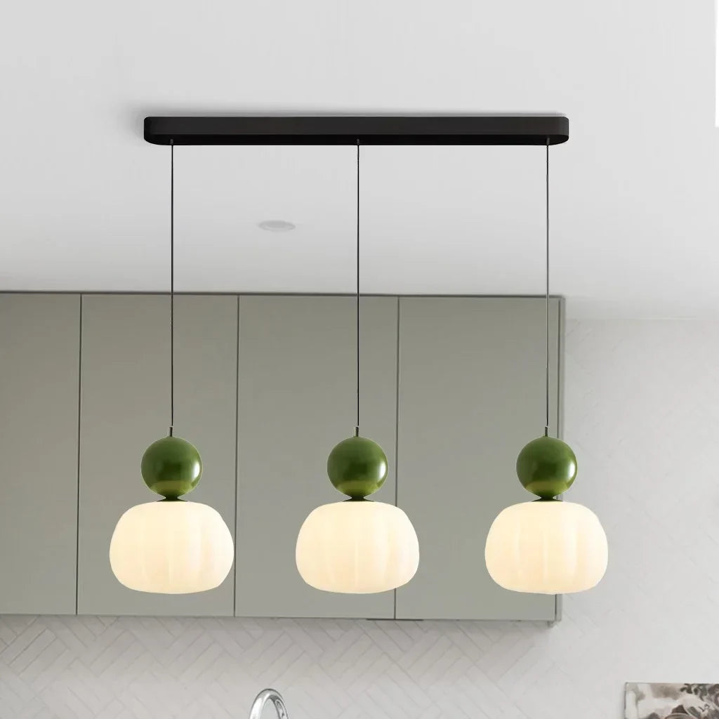 Pendant lamp with glass globe and decorative top for indoor use