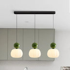 Pendant lamp with glass globe and decorative top for indoor use