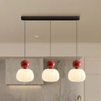 Pendant lamp with glass globe and decorative top for indoor use