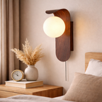 Wall lamp in wood with glass globe for indoor use