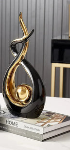Abstract decorative figure in ceramic with gold finish