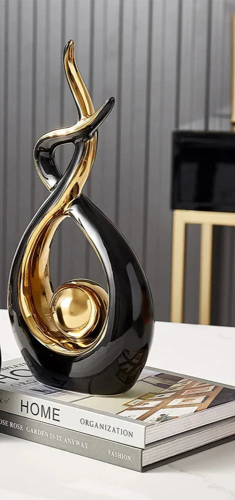 Abstract decorative figure in ceramic with gold finish