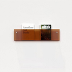 Space-saving wall storage for books and documents – Wall-mounted magazine holder