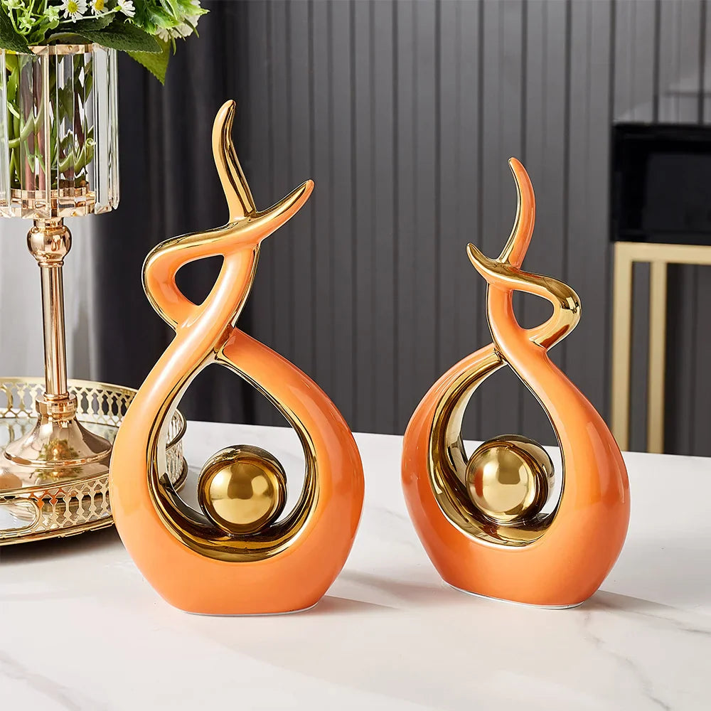 Abstract decorative figure in ceramic with gold finish