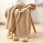 Warm home textiles for sofa and relaxation – Wool blanket with tassels