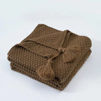 Warm home textiles for sofa and relaxation – Wool blanket with tassels