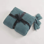 Warm home textiles for sofa and relaxation – Wool blanket with tassels