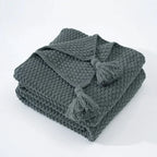 Warm home textiles for sofa and relaxation – Wool blanket with tassels