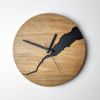 Round wall clock in wood with black details