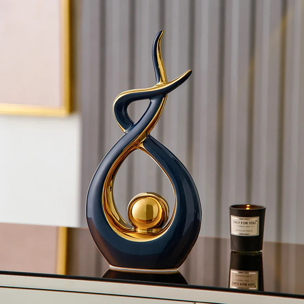 Abstract decorative figure in ceramic with gold finish
