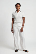Casual polo for everyday use – Textured polo with half zipper for women