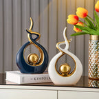 Abstract decorative figure in ceramic with gold finish
